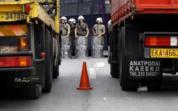Riot policemen block truckers attempting to drive towards Athens to protest against liberalization of their sector in the Chaidari suburb REUTERS/Yiorgos Karahalis